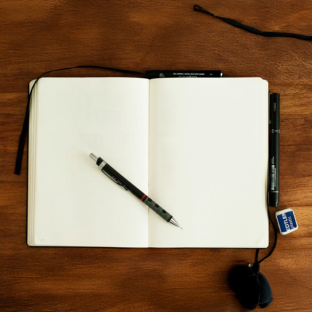 A notebook is open with pen in the middle - Inner Oak Therapy Psychotherapy